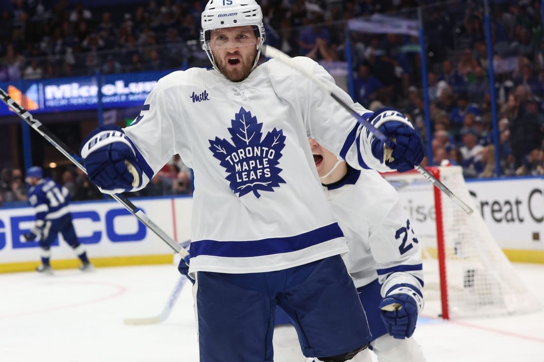 Apr 24, 2023; Tampa, Florida, USA; Toronto Maple Leafs center Alexander Kerfoot (15) celebrates after he scored the game-winning goal against the Tampa Bay Lightning in overtime of game four of the first round of the 2023 Stanley Cup Playoffs at Amalie Arena. Mandatory Credit: Kim Klement-USA TODAY Sports