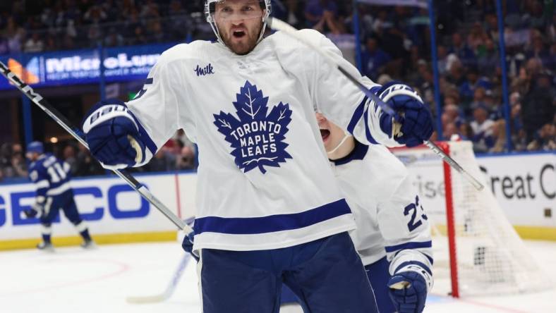 Apr 24, 2023; Tampa, Florida, USA; Toronto Maple Leafs center Alexander Kerfoot (15) celebrates after he scored the game-winning goal against the Tampa Bay Lightning in overtime of game four of the first round of the 2023 Stanley Cup Playoffs at Amalie Arena. Mandatory Credit: Kim Klement-USA TODAY Sports