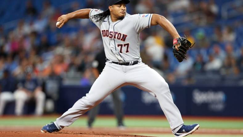 Apr 25, 2023; St. Petersburg, Florida, USA;  Houston Astros starting pitcher Luis Garcia (77) throws a pitch against the Tampa Bay Rays in the first inning at Tropicana Field. Mandatory Credit: Nathan Ray Seebeck-USA TODAY Sports