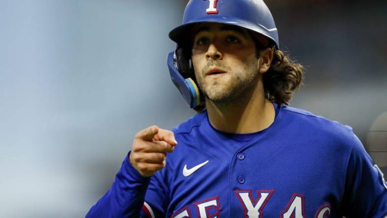 Apr 25, 2023; Cincinnati, Ohio, USA; Texas Rangers third baseman Josh Jung (6) reacts after hitting a solo home run in the sixth inning against the Cincinnati Reds at Great American Ball Park. Mandatory Credit: Katie Stratman-USA TODAY Sports