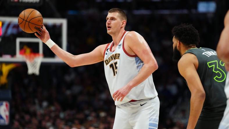 Apr 25, 2023; Denver, Colorado, USA; Denver Nuggets center Nikola Jokic (15) passes in the first half against the Minnesota Timberwolves in game five of the 2023 NBA Playoffs at Ball Arena. Mandatory Credit: Ron Chenoy-USA TODAY Sports