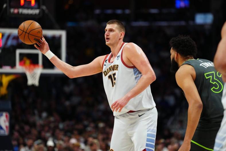 Apr 25, 2023; Denver, Colorado, USA; Denver Nuggets center Nikola Jokic (15) passes in the first half against the Minnesota Timberwolves in game five of the 2023 NBA Playoffs at Ball Arena. Mandatory Credit: Ron Chenoy-USA TODAY Sports