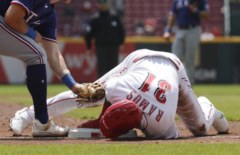 Apr 26, 2023; Cincinnati, Ohio, USA; Cincinnati Reds right fielder Henry Ramos (31) slides safely into third base for an RBI triple against the Texas Rangers during the second inning at Great American Ball Park. Mandatory Credit: David Kohl-USA TODAY Sports