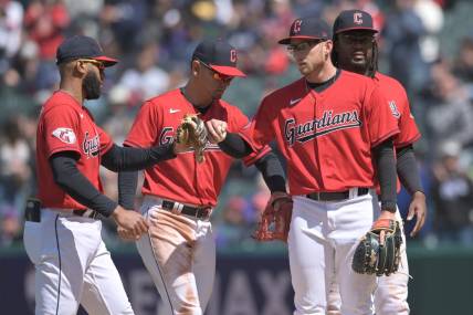 Apr 26, 2023; Cleveland, Ohio, USA; Cleveland Guardians starting pitcher Tanner Bibee, second right, celebrates with shortstop Amed Rosario, left, second baseman Andres Gimenez, second left, and first baseman Josh Bell during the sixth inning against the Colorado Rockies at Progressive Field. Mandatory Credit: Ken Blaze-USA TODAY Sports