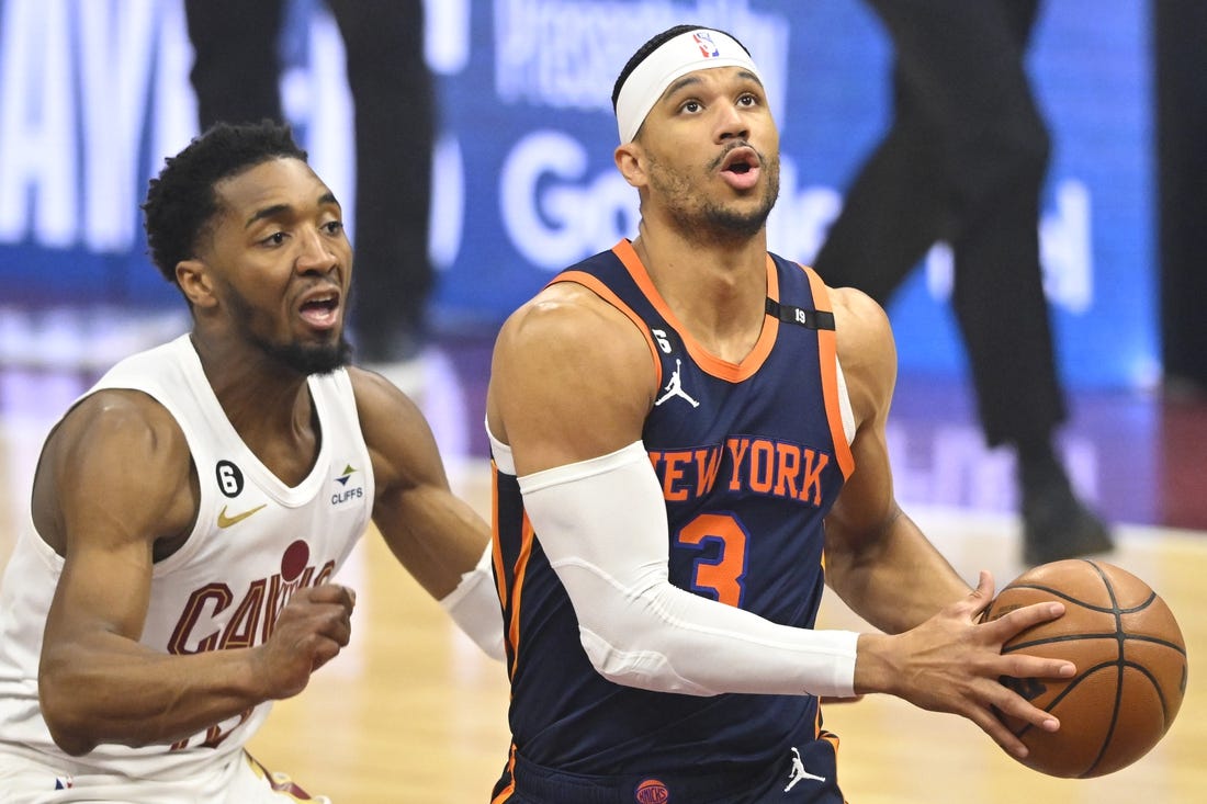 Apr 26, 2023; Cleveland, Ohio, USA; New York Knicks guard Josh Hart (3) drives beside Cleveland Cavaliers guard Donovan Mitchell (45) in the first quarter during game five of the 2023 NBA playoffs at Rocket Mortgage FieldHouse. Mandatory Credit: David Richard-USA TODAY Sports