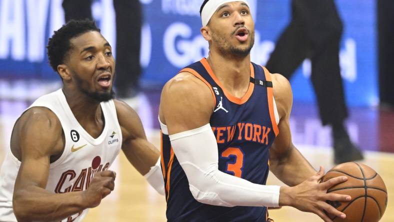 Apr 26, 2023; Cleveland, Ohio, USA; New York Knicks guard Josh Hart (3) drives beside Cleveland Cavaliers guard Donovan Mitchell (45) in the first quarter during game five of the 2023 NBA playoffs at Rocket Mortgage FieldHouse. Mandatory Credit: David Richard-USA TODAY Sports