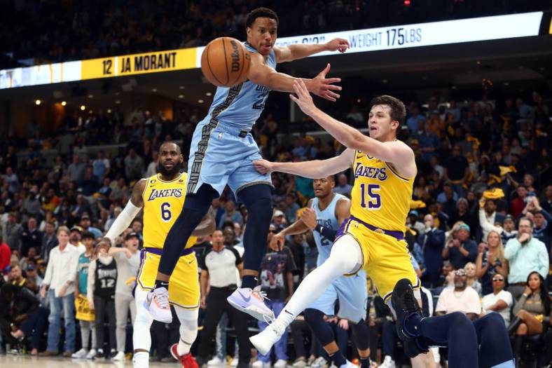 Apr 26, 2023; Memphis, Tennessee, USA; Los Angeles Lakers guard Austin Reaves (15) passes the ball as Memphis Grizzlies guard Desmond Bane (22) defends during the first half during game five of the 2023 NBA playoffs at FedExForum. Mandatory Credit: Petre Thomas-USA TODAY Sports