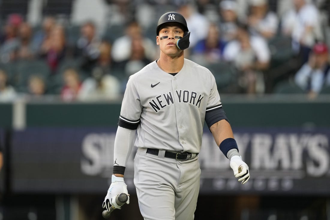 Apr 27, 2023; Arlington, Texas, USA; New York Yankees right fielder Aaron Judge (99) reacts after striking out against the Texas Rangers during the first inning at Globe Life Field. Mandatory Credit: Jim Cowsert-USA TODAY Sports