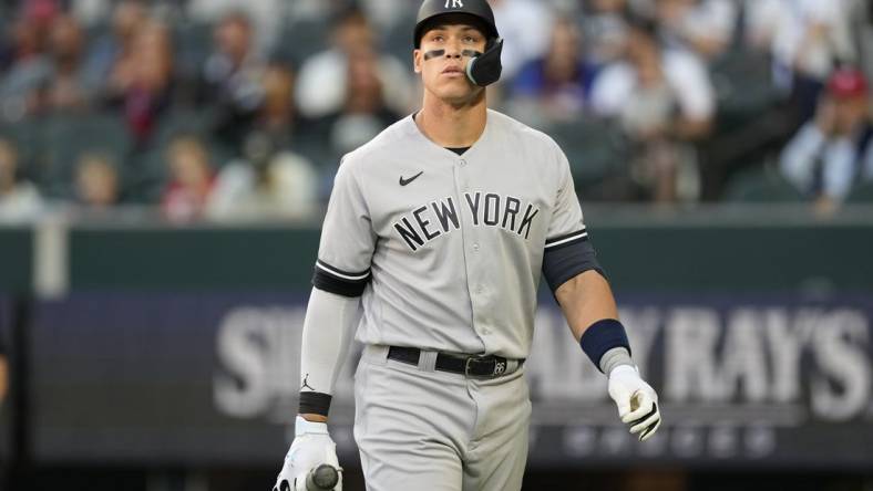 Apr 27, 2023; Arlington, Texas, USA; New York Yankees right fielder Aaron Judge (99) reacts after striking out against the Texas Rangers during the first inning at Globe Life Field. Mandatory Credit: Jim Cowsert-USA TODAY Sports