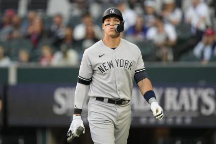 Apr 27, 2023; Arlington, Texas, USA; New York Yankees right fielder Aaron Judge (99) reacts after striking out against the Texas Rangers during the first inning at Globe Life Field. Mandatory Credit: Jim Cowsert-USA TODAY Sports