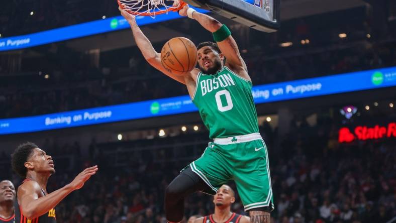 Apr 27, 2023; Atlanta, Georgia, USA; Boston Celtics forward Jayson Tatum (0) dunks the ball against the Atlanta Hawks in the first quarter during game six of the 2023 NBA playoffs at State Farm Arena. Mandatory Credit: Brett Davis-USA TODAY Sports