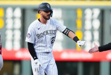 Apr 28, 2023; Denver, Colorado, USA; Colorado Rockies right fielder Kris Bryant (23) reacts following his single in the first inning the Arizona Diamondbacks at Coors Field. Mandatory Credit: Ron Chenoy-USA TODAY Sports
