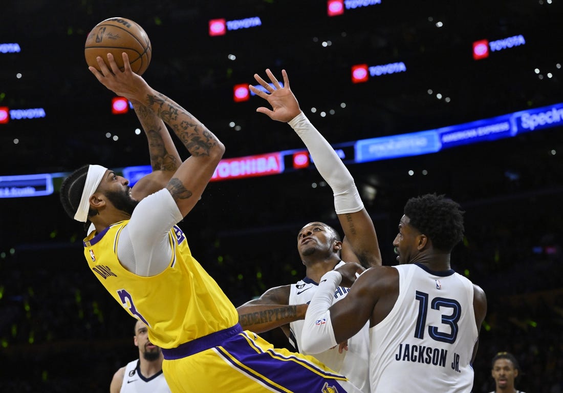 Apr 28, 2023; Los Angeles, California, USA;Los Angeles Lakers forward Anthony Davis (3) is defended by Memphis Grizzlies forward Xavier Tillman (2) and forward Jaren Jackson Jr. (13) as he goes up for a shot in the first quarter of game six of the 2023 NBA playoffs at Crypto.com Arena. Mandatory Credit: Jayne Kamin-Oncea-USA TODAY Sports