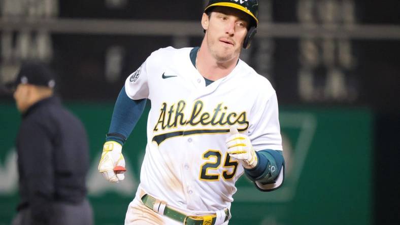 Apr 28, 2023; Oakland, California, USA; Oakland Athletics designated hitter Brent Rooker (25) rounds the bases on a. Two-run home run against the Cincinnati Reds during the ninth inning at Oakland Coliseum. Mandatory Credit: Kelley L Cox-USA TODAY Sports