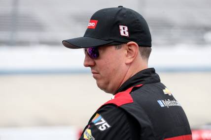 Apr 29, 2023; Dover, Delaware, USA; NASCAR Cup Series driver Kyle Busch stands behind the pit road wall during practice and qualifying for the Wurth 400 at Dover Motor Speedway. Mandatory Credit: Matthew OHaren-USA TODAY Sports