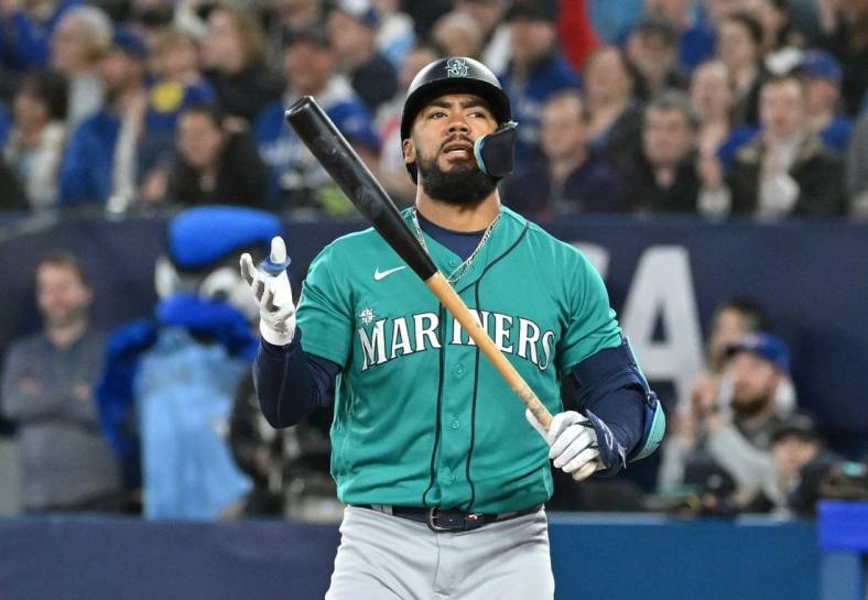 Apr 29, 2023; Toronto, Ontario, CAN; Seattle Mariners right fielder Teoscar Hernandez (35) reacts after striking out for the fourth time against the Toronto Blue Jays in the ninth inning at Rogers Centre. Mandatory Credit: Dan Hamilton-USA TODAY Sports