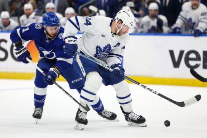 Apr 29, 2023; Tampa, Florida, USA; Toronto Maple Leafs defenseman Morgan Rielly (44) keeps the puck from Tampa Bay Lightning center Anthony Cirelli (71) in the first period  during game six of the first round of the 2023 Stanley Cup Playoffs at Amalie Arena. Mandatory Credit: Nathan Ray Seebeck-USA TODAY Sports