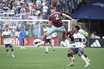 Apr 29, 2023; Vancouver, British Columbia, CAN;  Colorado Rapids defender Keegan Rosenberry (2) jumps to control the all against the Vancouver Whitecaps FC during the first half at BC Place. Mandatory Credit: Anne-Marie Sorvin-USA TODAY Sports