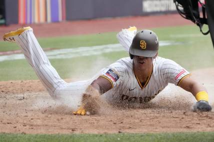 Apr 30, 2023; Mexico City, Mexico; San Diego Padres left fielder Juan Soto (22) slides into home plate to score in the eighth inning after the game during a MLB World Tour game at Estadio Alfredo Harp Helu. Mandatory Credit: Kirby Lee-USA TODAY Sports