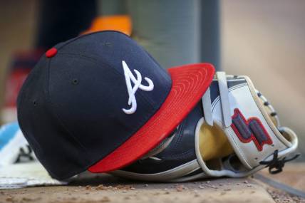 May 31, 2019; Atlanta, GA, USA; Detailed view of hat and glove of Atlanta Braves center fielder Ronald Acuna Jr. (not pictured) against the Detroit Tigers in the fourth inning at SunTrust Park. Mandatory Credit: Brett Davis-USA TODAY Sports