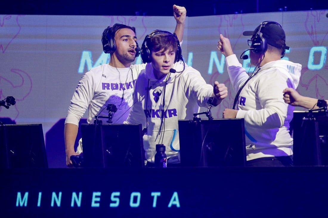 Jan 26, 2020; Minneapolis, Minnesota, USA; Obaid Asim and Alex Alexx Carpenter and Adam Assault Garcia of the Minnesota Rokkr celebrate after defeating the Toronto Ultra in a round during the Call of Duty League Launch Weekend at The Armory. Mandatory Credit: Bruce Kluckhohn-USA TODAY Sports