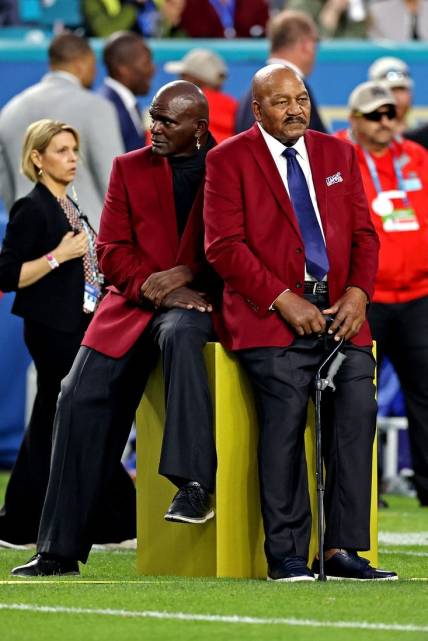 Feb 2, 2020; Miami Gardens, Florida, USA; NFL 100 All-Time Team members Lawrence Taylor and Jim Brown before Super Bowl LIV between the San Francisco 49ers and the Kansas City Chiefs at Hard Rock Stadium. Mandatory Credit: Matthew Emmons-USA TODAY Sports