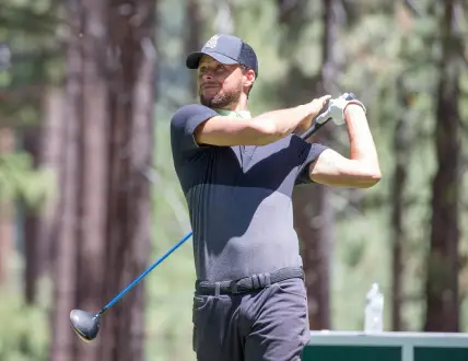 Stephen Curry swings during the ACC Golf Tournament at Edgewood Tahoe Golf Course in South Lake Tahoe on Saturday, July 11, 2020.