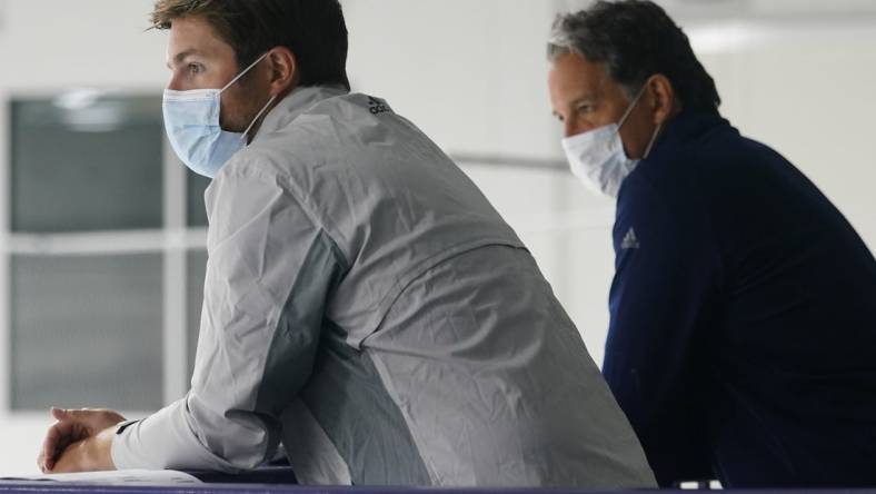 Jul 13, 2020; Toronto, Ontario, Canada; Toronto Maple Leafs general manager Kyle Dubas (left) and president Brendan Shanahan (right) watch a NHL workout at the Ford Performance Centre. Mandatory Credit: John E. Sokolowski-USA TODAY Sports