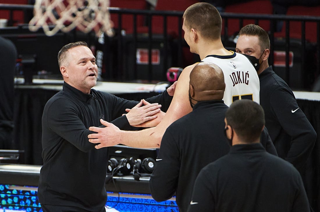 Nuggets head coach Michael Malone and center Nikola Jokic (15) were ignited by the media narrative around the Lakers after Game 1. Mandatory Credit: Troy Wayrynen-USA TODAY Sports