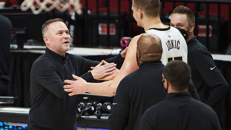 Nuggets head coach Michael Malone and center Nikola Jokic (15) were ignited by the media narrative around the Lakers after Game 1. Mandatory Credit: Troy Wayrynen-USA TODAY Sports