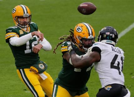 Green Bay Packers quarterback Aaron Rodgers (12) rifles a pass while Green Bay Packers offensive tackle Billy Turner (77) blocks Jacksonville Jaguars defensive end Josh Allen (41) the second quarter of their game at Lambeau Field in Green Bay, Wis.

Mjs Jenkins 6 Jpg Packers16