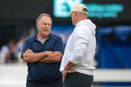 Aug 29, 2021; East Rutherford, New Jersey, USA; New England Patriots head coach Bill Belichick, left, talks with New York Giants head coach Joe Judge before the game at MetLife Stadium. Mandatory Credit: Vincent Carchietta-USA TODAY Sports