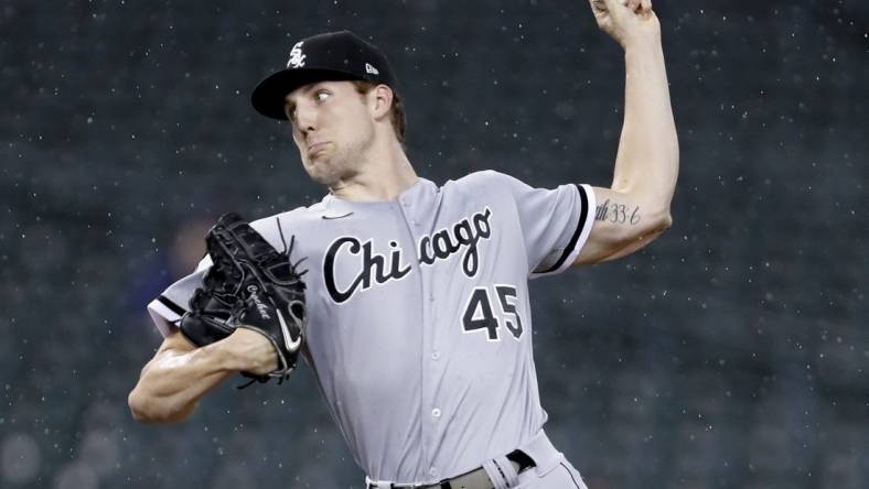 Sep 20, 2021; Detroit, Michigan, USA; Chicago White Sox relief pitcher Garrett Crochet (45) throws in the rain during the sixth inning against the Detroit Tigers at Comerica Park. Mandatory Credit: Raj Mehta-USA TODAY Sports