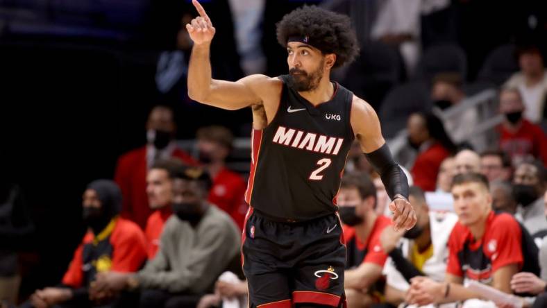 Jan 12, 2022; Atlanta, Georgia, USA; Miami Heat guard Gabe Vincent (2) reacts after a basket during the fourth quarter against the Atlanta Hawks at State Farm Arena. Mandatory Credit: Jason Getz-USA TODAY Sports