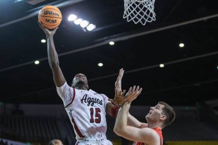 Mike Peake (15) goes up for a layup as the New Mexico State Aggies face the Dixie State Trailblazers at the Pan American Center in Las cruces on Wednesday, Feb. 16, 2022.

Nmsu Dsu 4