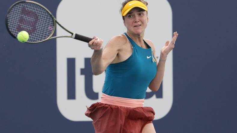 Mar 24, 2022; Miami Gardens, FL, USA; Elina Svitolina (UKR) hits a forehand against Heather Watson (GBR) (not pictured) in a second round women's singles match in the Miami Open at Hard Rock Stadium. Mandatory Credit: Geoff Burke-USA TODAY Sports