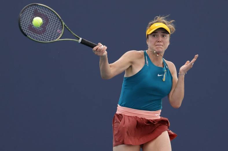 Mar 24, 2022; Miami Gardens, FL, USA; Elina Svitolina (UKR) hits a forehand against Heather Watson (GBR) (not pictured) in a second round women's singles match in the Miami Open at Hard Rock Stadium. Mandatory Credit: Geoff Burke-USA TODAY Sports