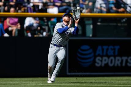 Apr 17, 2022; Denver, Colorado, USA; Chicago Cubs left fielder Clint Frazier (77) makes a catch for an out in the fifth inning against the Colorado Rockies at Coors Field. Mandatory Credit: Isaiah J. Downing-USA TODAY Sports