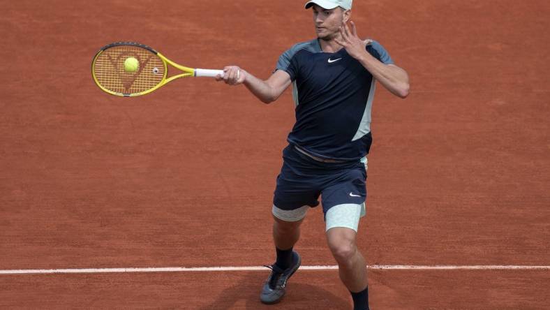 May 28, 2022; Paris, France; Miomir Kecmanovic (SRB) returns a shot from Daniil Medvedev during their match on day seven of the French Open at Stade Roland-Garros. Mandatory Credit: Susan Mullane-USA TODAY Sports