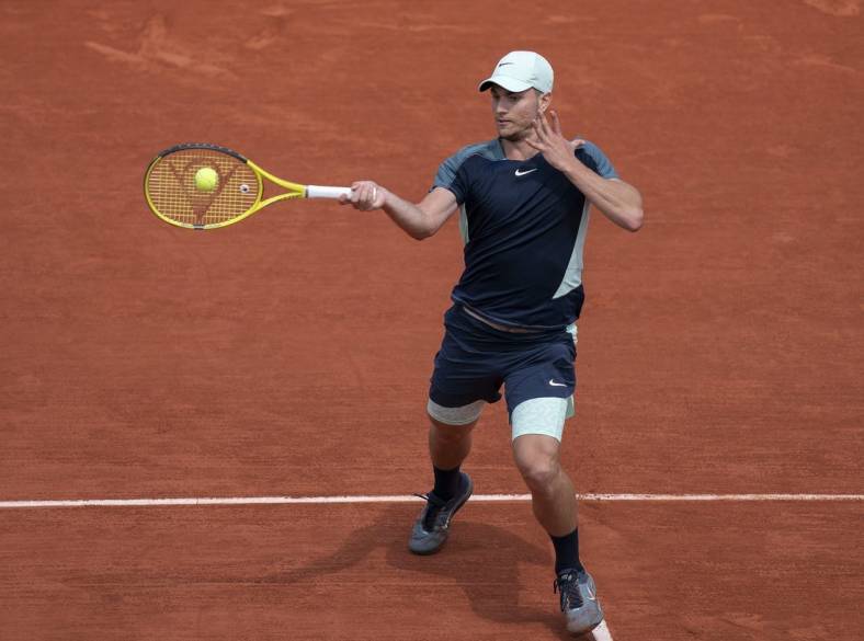 May 28, 2022; Paris, France; Miomir Kecmanovic (SRB) returns a shot from Daniil Medvedev during their match on day seven of the French Open at Stade Roland-Garros. Mandatory Credit: Susan Mullane-USA TODAY Sports