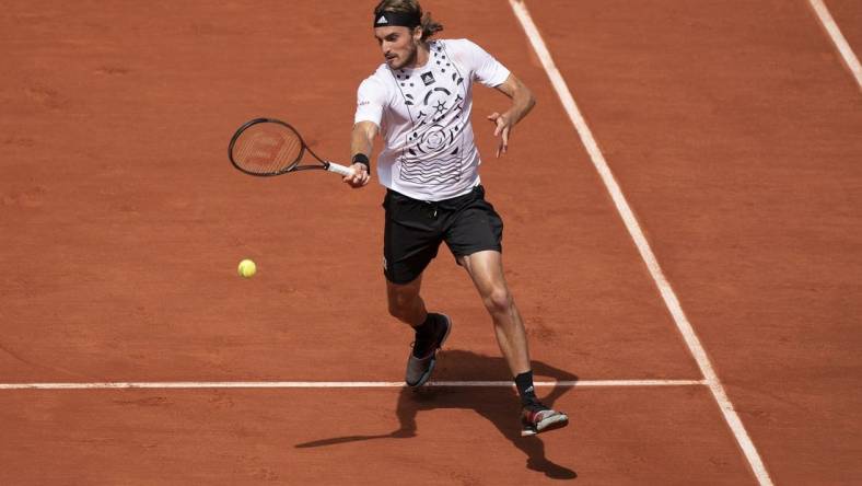 May 30, 2022; Paris, France; Stefanos Tsitsipas (GRE) returns a shot in his match against Holger Rune (DEN) on day nine of the French Open at Stade Roland-Garros. Mandatory Credit: Susan Mullane-USA TODAY Sports