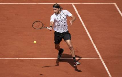 May 30, 2022; Paris, France; Stefanos Tsitsipas (GRE) returns a shot in his match against Holger Rune (DEN) on day nine of the French Open at Stade Roland-Garros. Mandatory Credit: Susan Mullane-USA TODAY Sports