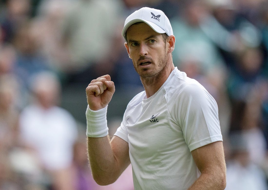 Jun 29, 2022; London, United Kingdom; Andy Murray (GBR) reacts to a point during his second round match against John Isner (USA) on day three at All England Lawn Tennis and Croquet Club. Mandatory Credit: Susan Mullane-USA TODAY Sports