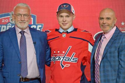 Jul 7, 2022; Montreal, Quebec, CANADA; Ivan Miroshnichenko after being selected as the number twenty overall pick to the Washington Capitals in the first round of the 2022 NHL Draft at Bell Centre. Mandatory Credit: Eric Bolte-USA TODAY Sports