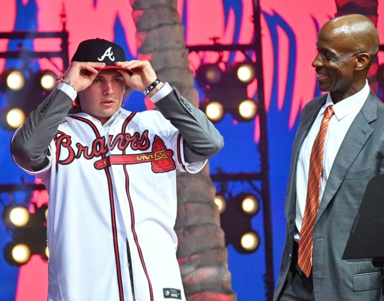 Jul 17, 2022; Los Angeles, CA, USA;  Former Atlanta Braves player Fred McGriff presents JR Ritchie right with his jersey after he was selected by the Atlanta Braves as the 35th pick of the MLB draft at XBox Plaza at LA Live. Mandatory Credit: Jayne Kamin-Oncea-USA TODAY Sports