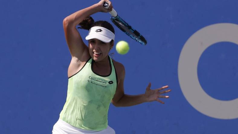 Aug 4, 2022; Washington, DC, USA;  Camila Osorio (COL) hits a forehand against Emma Raducanu (GBR) (not pictured) on day four of the Citi Open at Rock Creek Park Tennis Center. Mandatory Credit: Geoff Burke-USA TODAY Sports