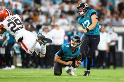Aug 12, 2022; Jacksonville, Florida, USA; Jacksonville Jaguars place kicker Elliott Fry (12) kicks an extra point against the Cleveland Browns in the second quarter during preseason at TIAA Bank Field. Mandatory Credit: Nathan Ray Seebeck-USA TODAY Sports