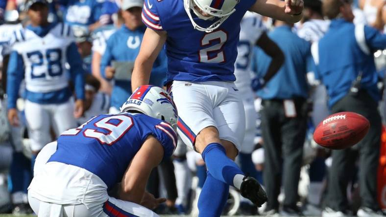 With Buffalo punter Matt Araiza (19) holding, kicker Tyler Bass (2) kicks a field goal during the Bills  27-24 win over Indianapolis in their preseason game Saturday, Aug. 13, 2022 at Highmark Stadium in Orchard Park.

Sd 081322 Bills 76 Spts