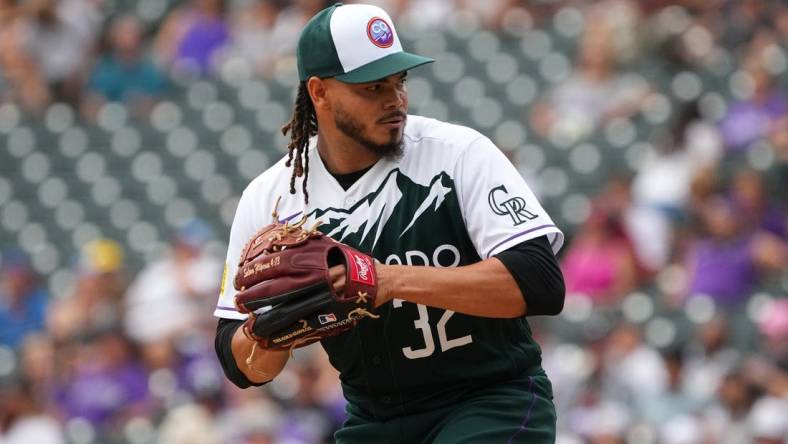 Aug 14, 2022; Denver, Colorado, USA; Colorado Rockies relief pitcher Dinelson Lamet (32) prepares to deliver a pitch in the eighth inning against the Arizona Diamondbacks at Coors Field. Mandatory Credit: Ron Chenoy-USA TODAY Sports