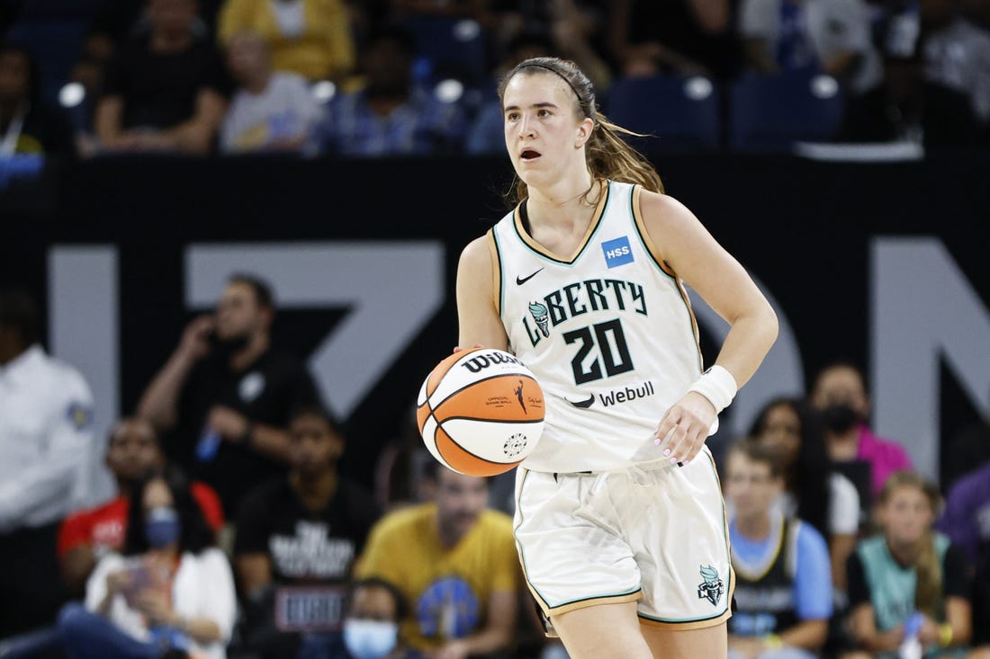 Aug 17, 2022; Chicago, Illinois, USA; New York Liberty guard Sabrina Ionescu (20) brings the ball up court against the Chicago Sky during the second half of game one of the first round of the WNBA playoffs at Wintrust Arena. Mandatory Credit: Kamil Krzaczynski-USA TODAY Sports